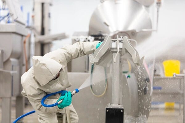 Industrial cleaning workers wearing PPE in Africa